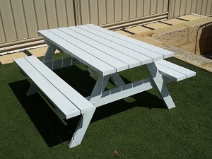 white picnic table on grass