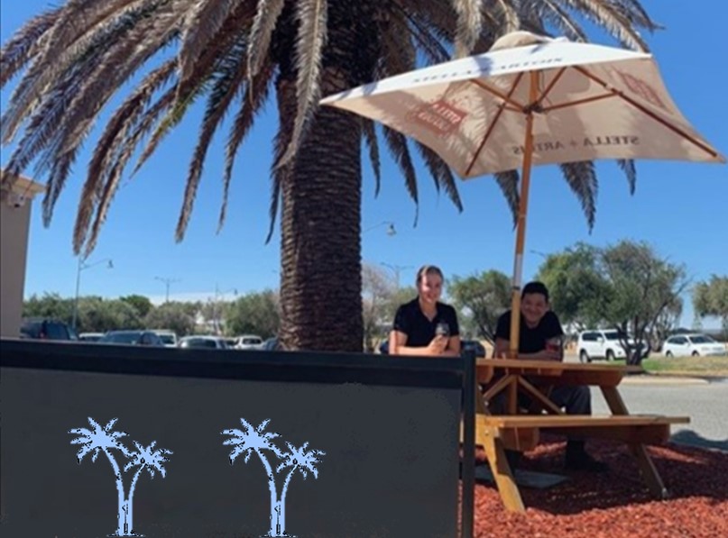 Prime Picnic Tables with two waiters posing in front at the Golf Course at Melbourne grounds